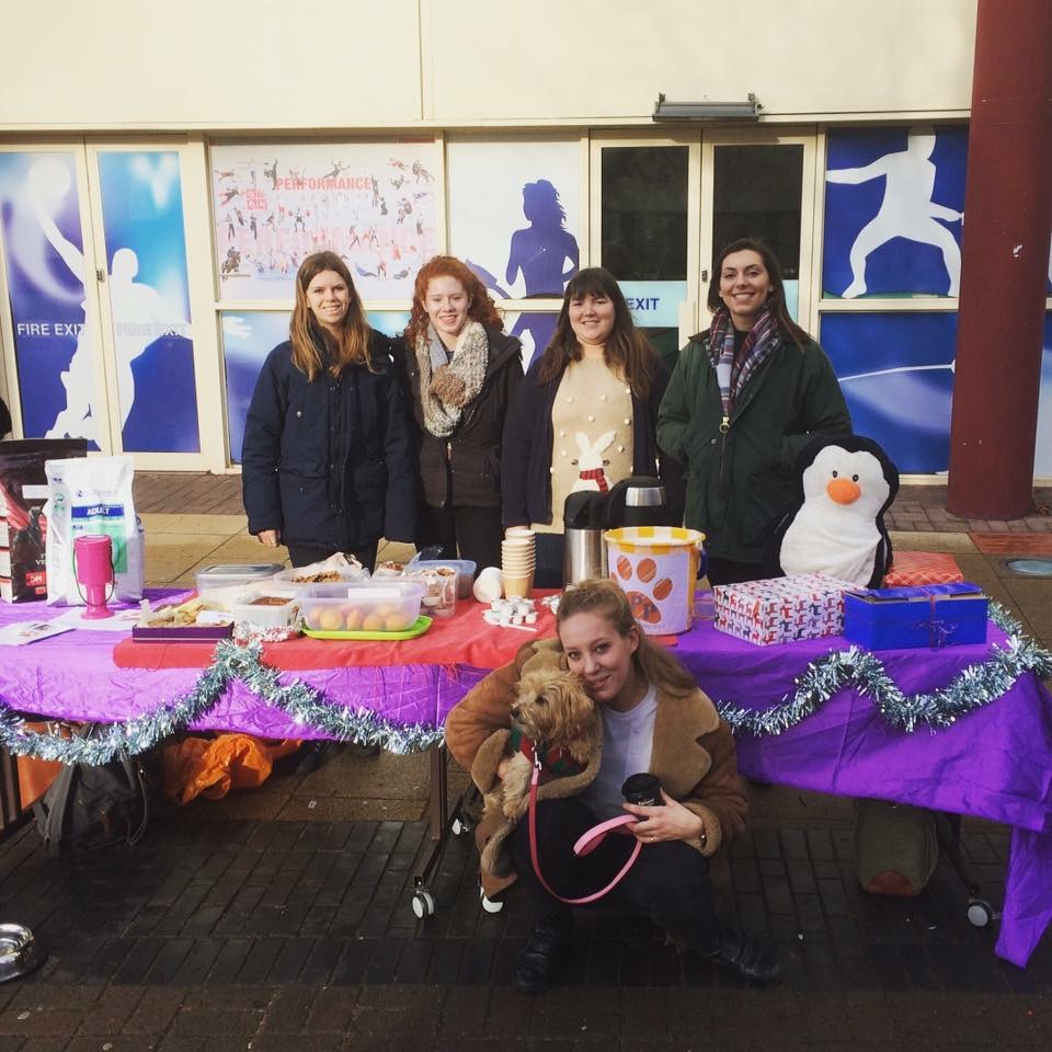 Part of the team of kind volunteers behind the charity prepare for their cake sale