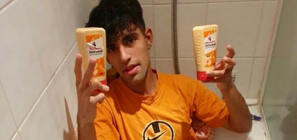 Image may contain: Apparel, Clothing, Indoors, Bottle, Face, Person, Human