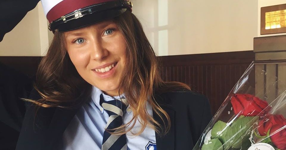 Image may contain: Female, Apparel, Clothing, Face, Human, Person, Tie, Accessories, Accessory