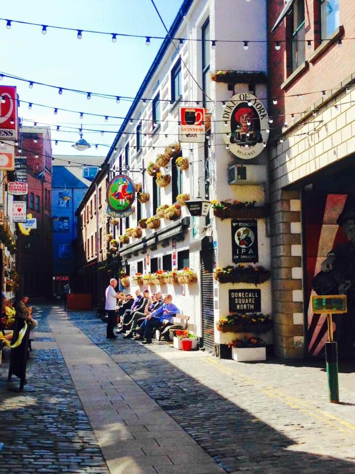 Image may contain: Alleyway, Alley, Indoors, Interior Design, Pavement, Sidewalk, Pedestrian, Walkway, Path, Person, Human, Road, Street, Town, Urban, City, Building