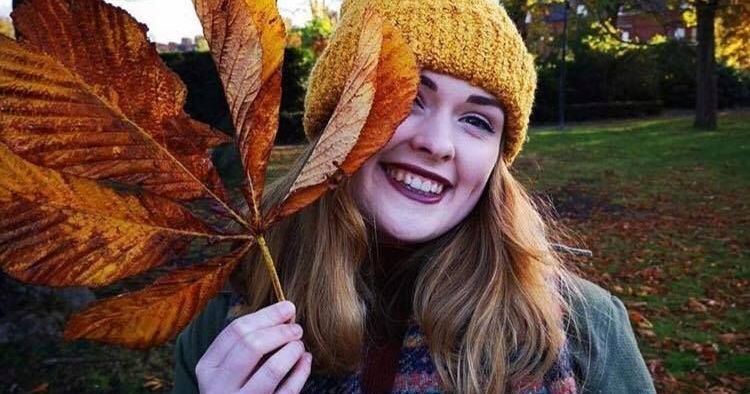 Image may contain: Hat, Portrait, Knitting, Photo, Photography, Female, Tree, Apparel, Clothing, Smile, Face, Human, Person, Plant, Leaf