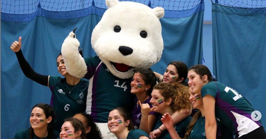 Image may contain: Apparel, Clothing, Female, Audience, People, Crowd, Smile, Face, Person, Human