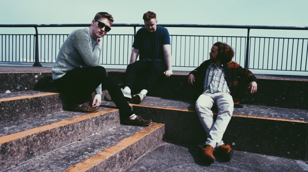 Beach rock, beach setting... Warm clothes. It is Wales, after all.