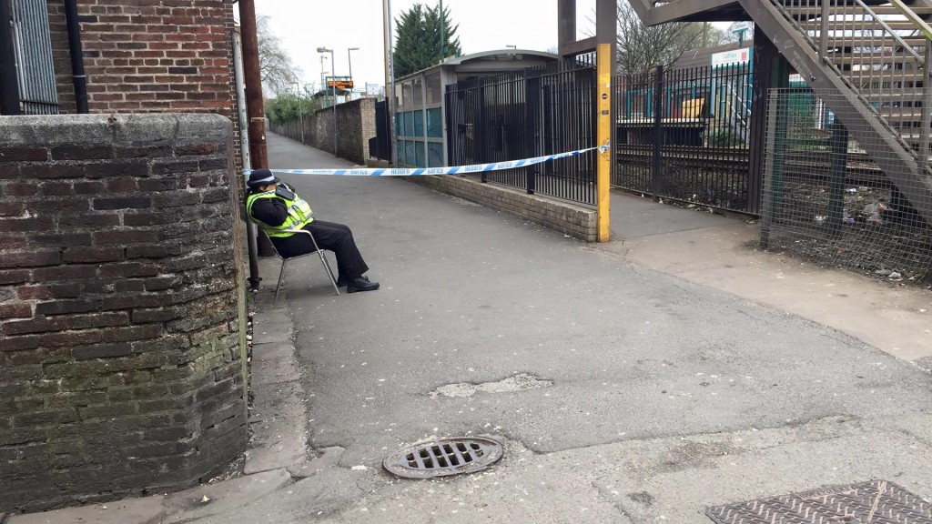 A police woman by the cordoned off area this morning
