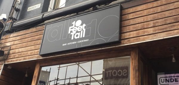 Image may contain: Advertisement, Billboard, Text