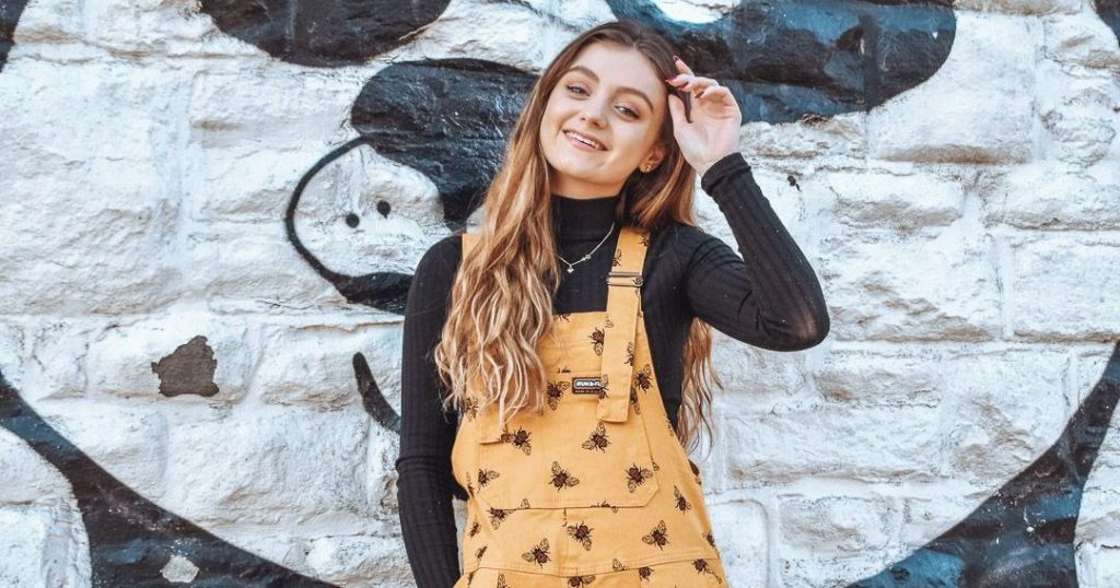 Image may contain: Dress, Portrait, Photo, Photography, Smile, Sleeve, Nature, Face, Outdoors, Rock, Blonde, Kid, Woman, Child, Girl, Teen, Apparel, Clothing, Human, Person, Female