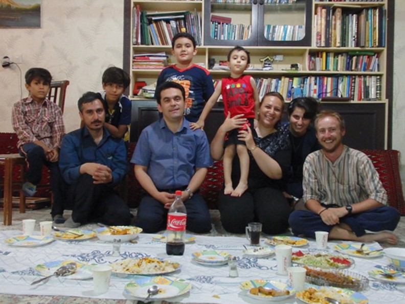 Jonathan with a host family in Iran