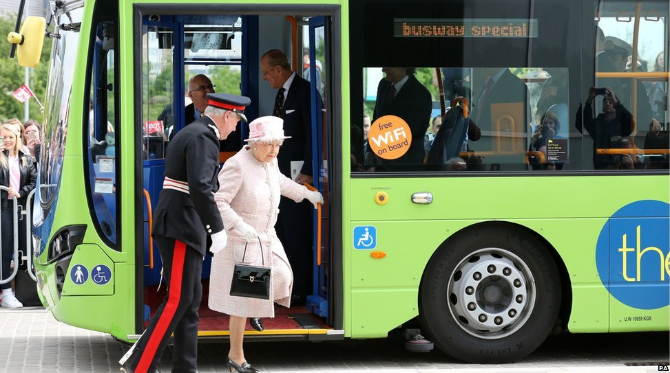 Easy does it: the Queen steps off a special service of the guided bus