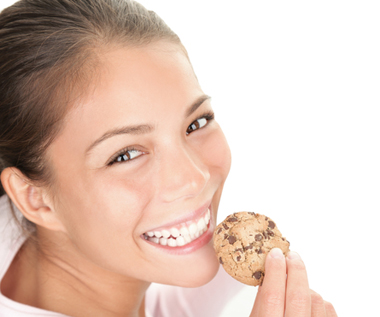 Just a wholesome girl eating a cookie. Or is she?