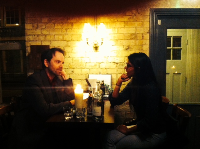 Discussing politics in the low-key lighting of an iPhone filter.
