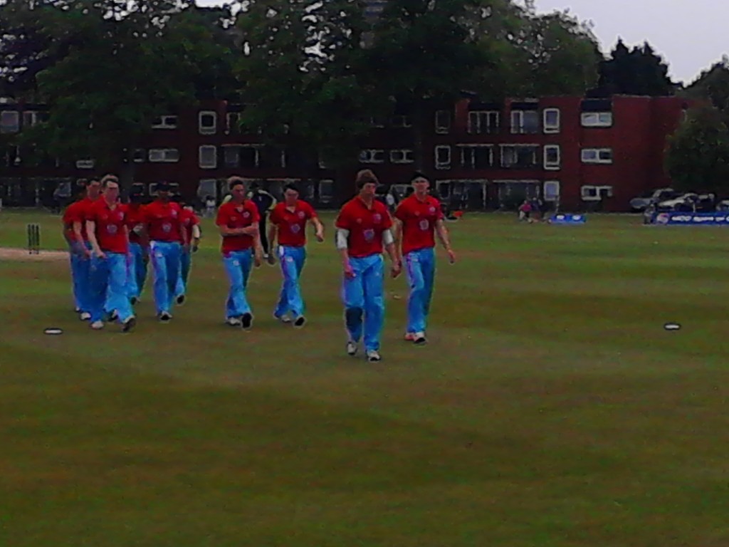 Cambridge leave the field after bowling out Oxford