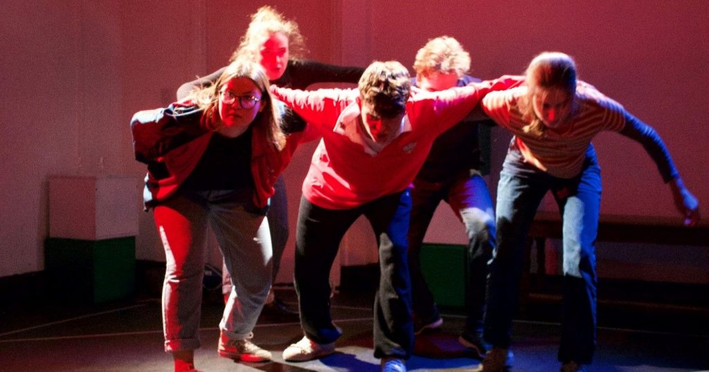 Image may contain: People, Crowd, Pants, Clothing, Footwear, Apparel, Shoe, Stage, Leisure Activities, Dance Pose, Human, Person