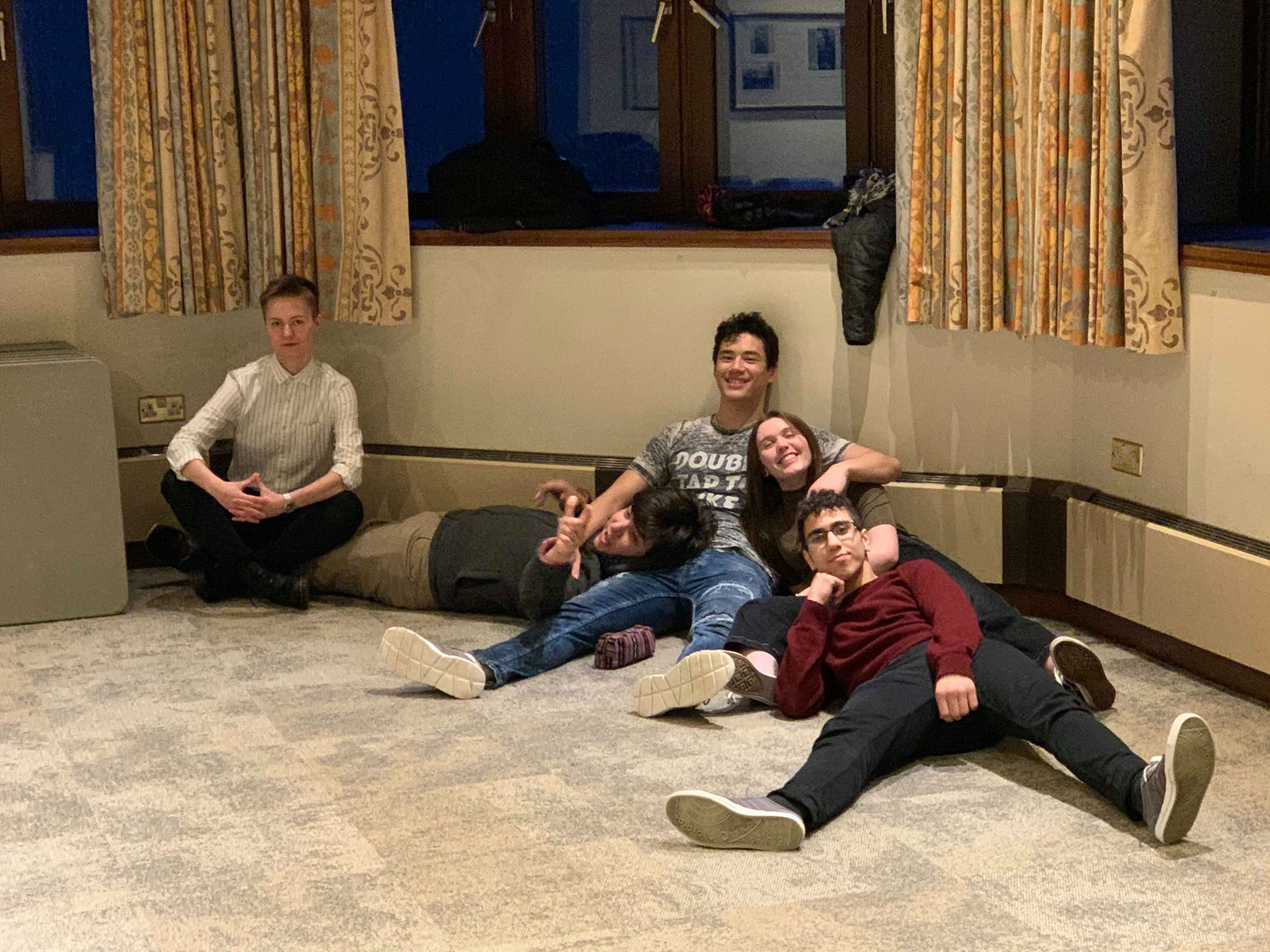 Image may contain: Pants, Footwear, Shoe, Floor, Flooring, Wood, Couch, Furniture, Apparel, Clothing, Sitting, Human, Person