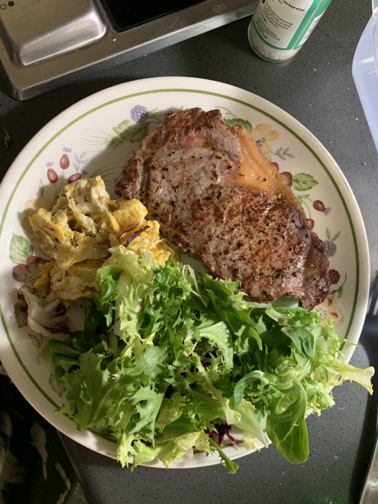 Plate of steak, egg and salad