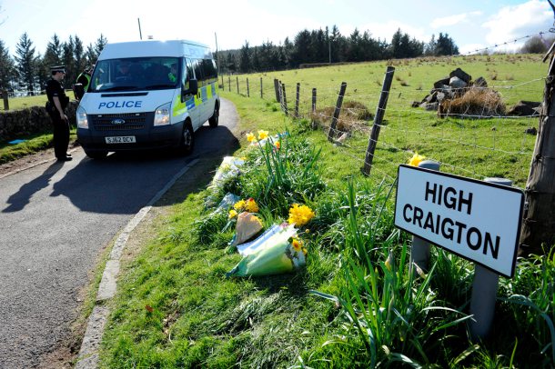 Floral tributes at High Craighton Farm near Bearsden, outside Glasgow, April 16, 2015, where body parts said to be from Karen Buckley, 24, were found