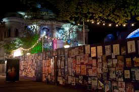 The Hadrian's wall of flyers in Bristo Square.