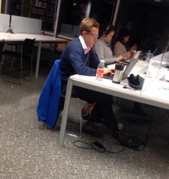 Is this young man doing his chemistry homework or watching Bridget Jones? Who knows.