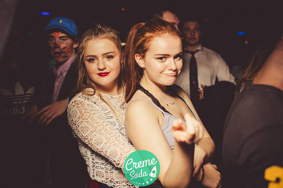 Check the guy behind them...