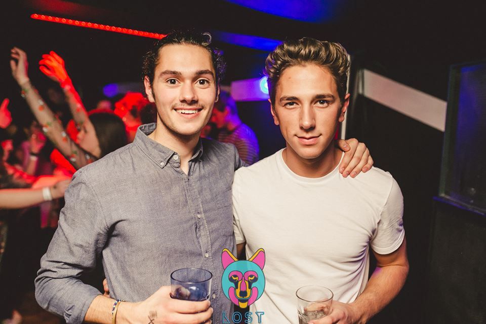 Image may contain: Night Life, Night Club, Club, Cup, Glass, Person, People, Human