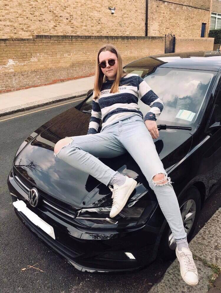 Image may contain: Female, Asphalt, Tarmac, Pants, Sedan, Face, Road, Accessory, Sunglasses, Accessories, Human, Person, Vehicle, Transportation, Automobile, Car, Footwear, Shoe, Clothing, Apparel