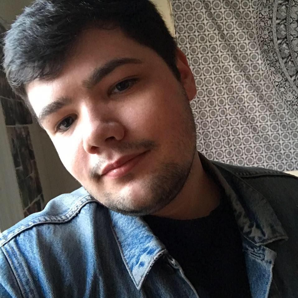 Image may contain: Photo, Photography, Portrait, Clothing, Apparel, Man, Cushion, Pillow, Face, Human, Person