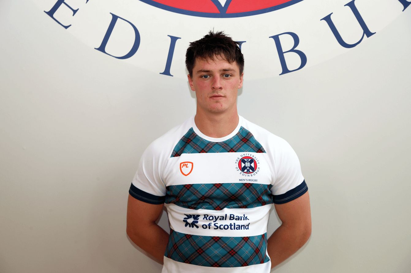 Image may contain: Logo, Symbol, Trademark, Text, Jersey, T-Shirt, Sleeve, Shirt, Person, Human, Apparel, Clothing