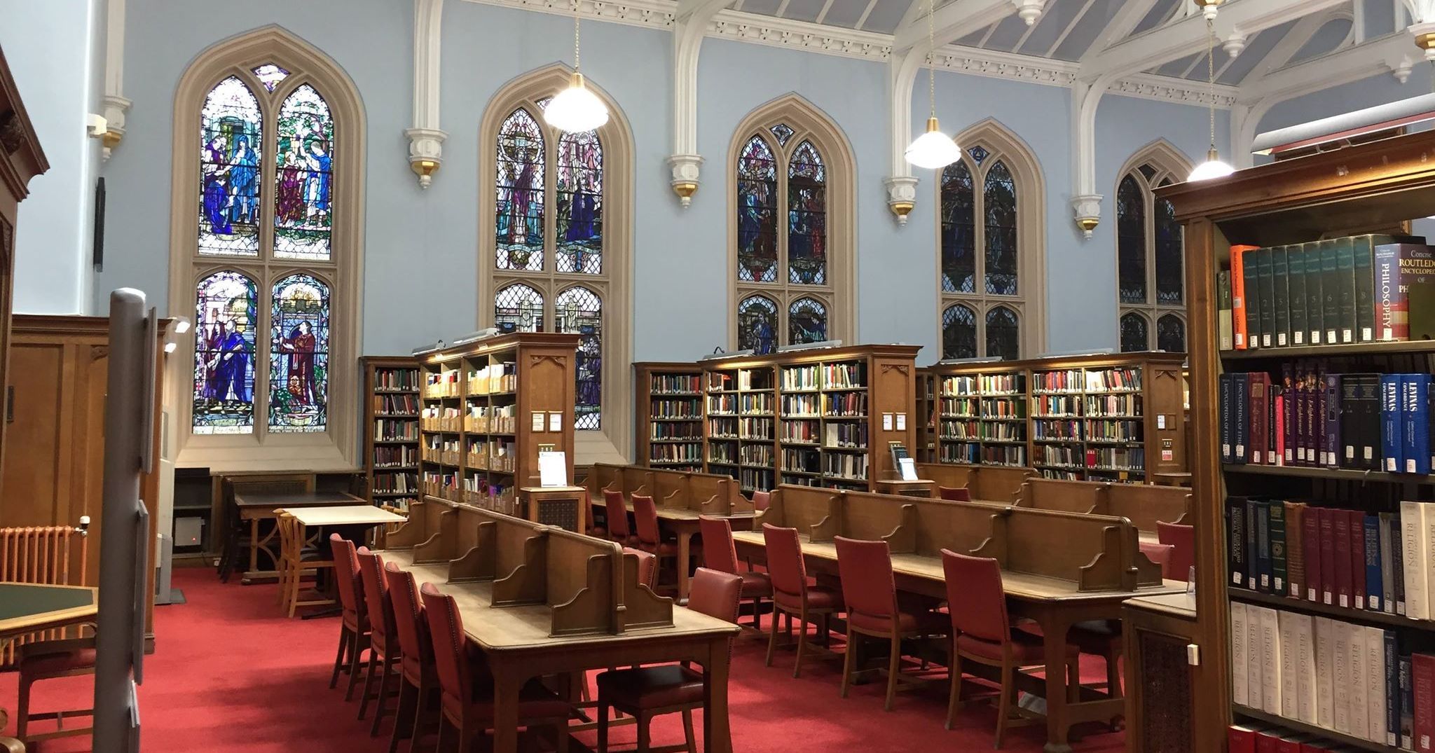 Image may contain: Library, Book, Room, Indoors, Chair, Furniture