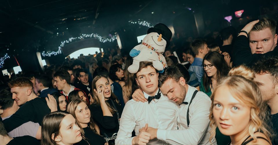 Image may contain: People, Nature, Outdoors, Night Life, Night Club, Audience, Crowd, Apparel, Clothing, Hat, Club, Party, Human, Person