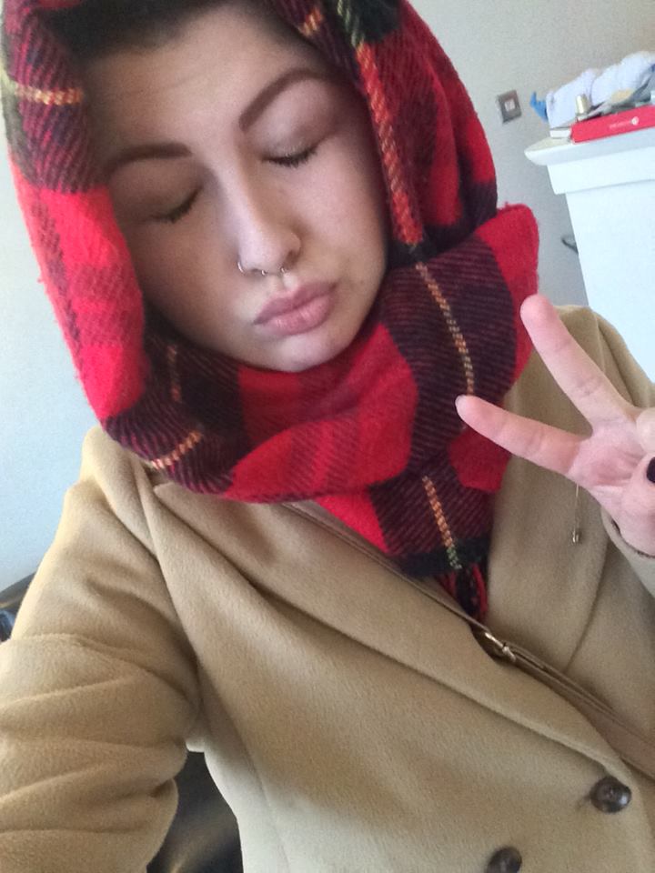 Didn't have an umbrella, not bothered about scarf hair