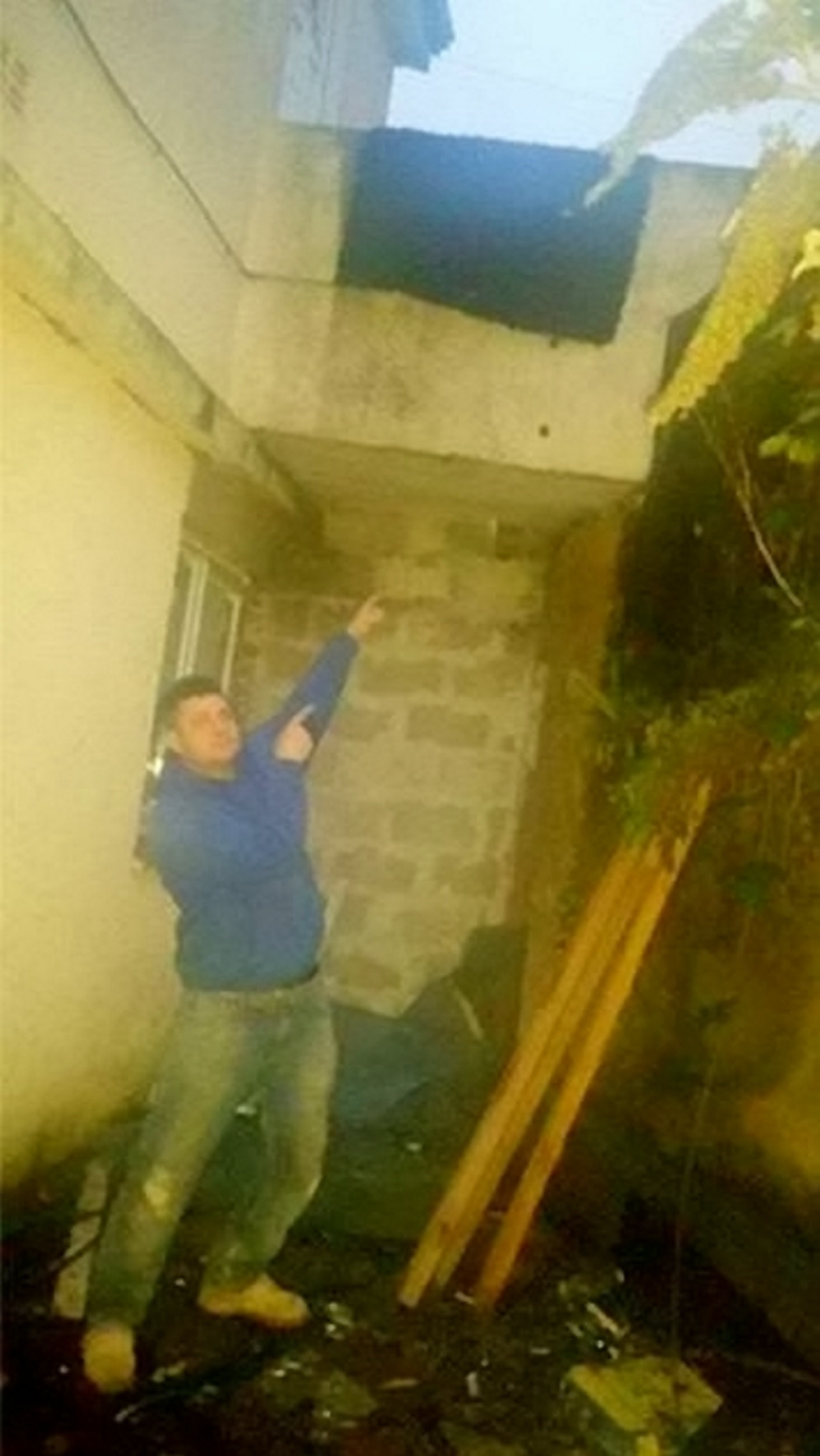Christopher Hepper points to the spot where the man fell through