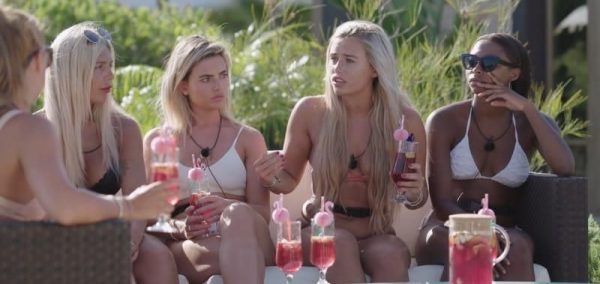 Image may contain: Swimwear, Clothing, Bikini, Cup, Woman, Girl, Female, Blonde, Vase, Pottery, Potted Plant, Plant, Jar, Flora, Person, People, Human