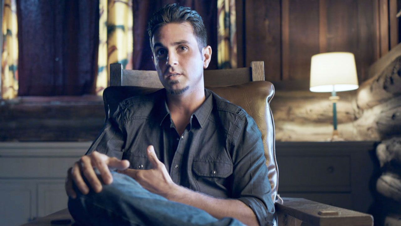 Image may contain: Leaving Neverland part 2, Leaving Neverland, Wade Robson, Man, Lamp, Furniture, Sitting, Person, Human