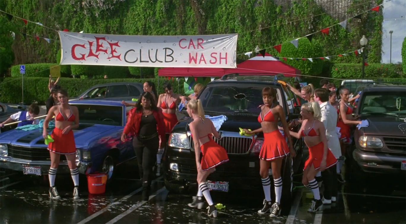 Image may contain: Female, Car Wash, Text, Crowd, Vehicle, Automobile, Transportation, Car, Footwear, Clothing, Apparel, Shoe, Human, Person