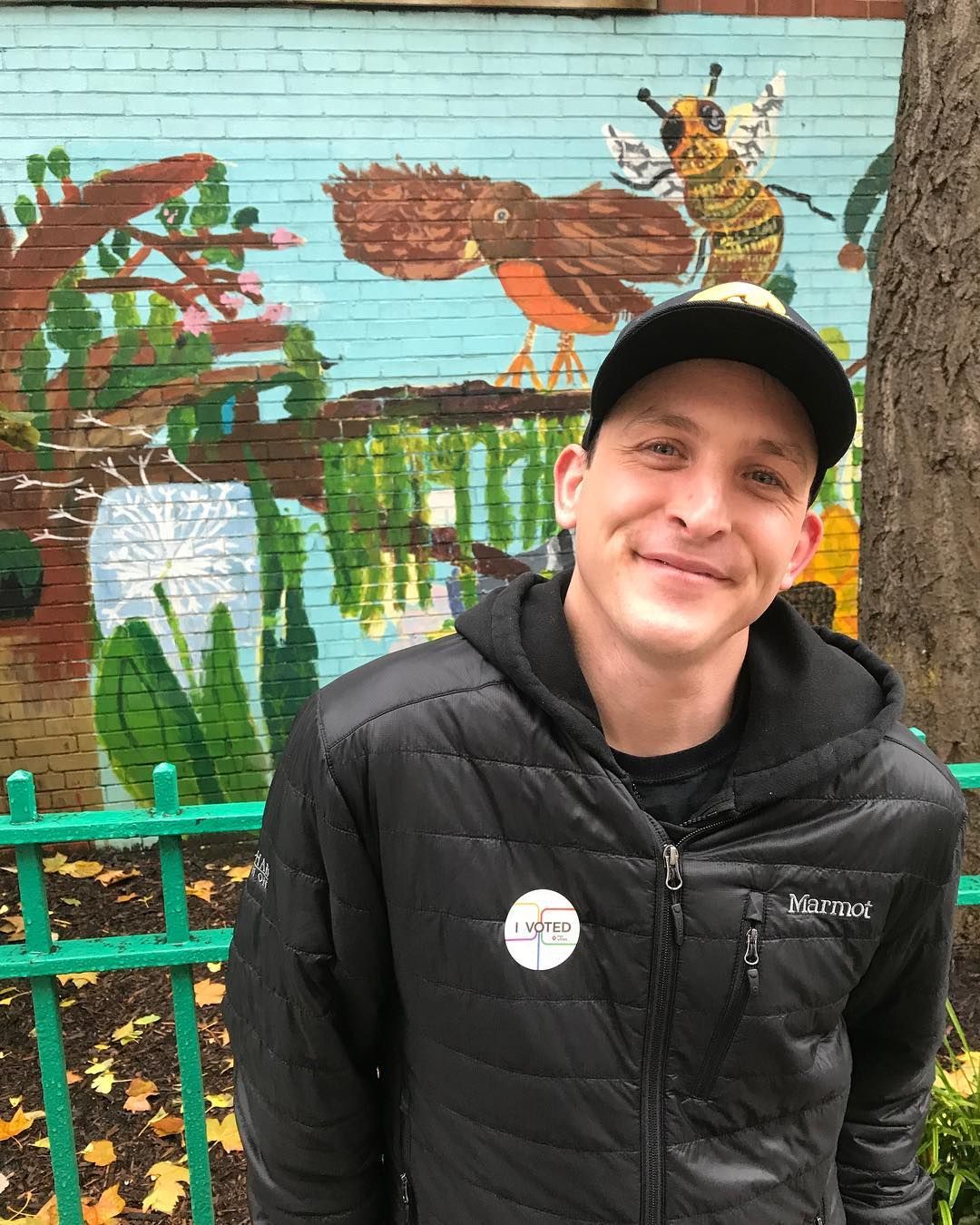 Image may contain: You season 2 cast, You, Netflix, Robin Lord Taylor, Will, season 2, cast, list, Portrait, Photo, Photography, Painting, Mural, Art, Tree, Plant, Wall, Outdoors, Face, Human, Person, Clothing, Apparel, Coat, Jacket