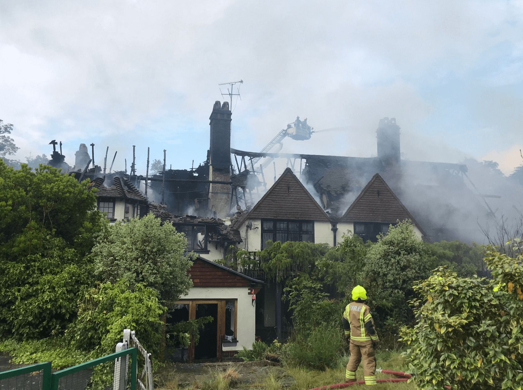 Image may contain: Oritse Williams house fire, Oritse Williams, JLS, house, fire, mansion, burned down, damage, pictures, news, Nature, Building, Outdoors, Roof, Human, Person