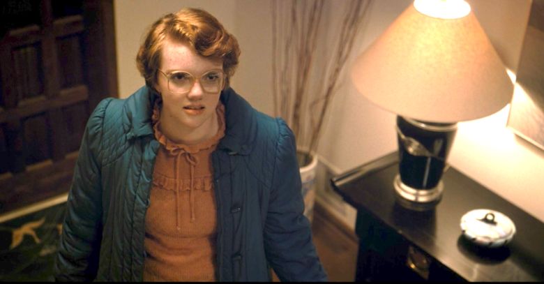 Image may contain: Stranger Things 3 end credit scene, post credits, Stranger Things 3, explained, theory, theories, ending, is Hopper dead, who, the American, door, spoilers, Netflix, finale, Stranger Things, Barb, alive, fan, Apparel, Clothing, Person, Human, Table Lamp, Lamp