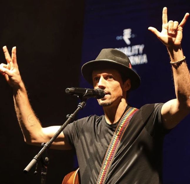 Image may contain: Crowd, Guitarist, Performer, Guitar, Leisure Activities, Electrical Device, Microphone, Hat, Clothing, Apparel, Musician, Musical Instrument, Person, Human