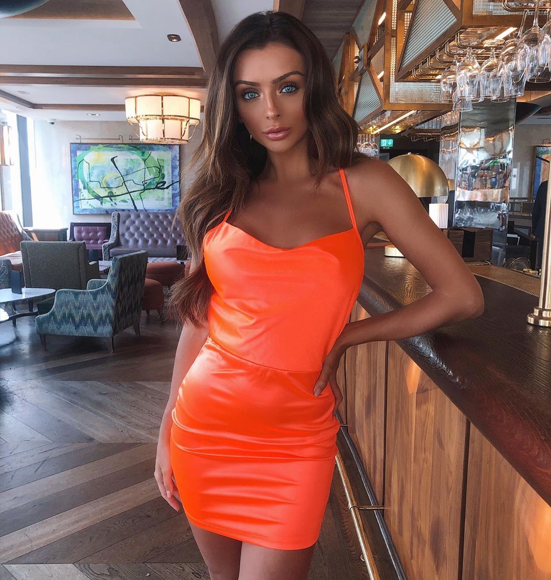 Image may contain: Love Island cast GCSE results, GCSE, results day, 2019, exams, Kady McDermott, Love Island, cast, Islanders, GCSE results day 2019, Hardwood, Pub, Bar Counter, Wood, Human, Person, Evening Dress, Robe, Fashion, Gown, Apparel, Clothing