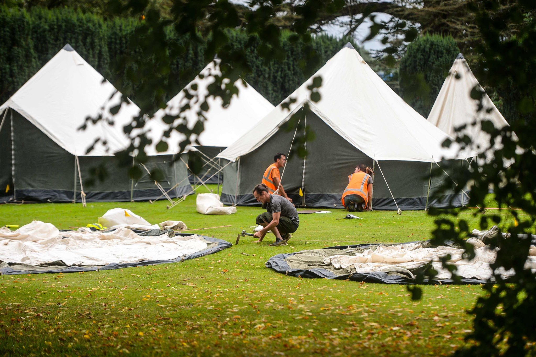 Image may contain: Caspar Jopling, Ellie Goulding, wedding, ceremony, pictures, wife, husband, fiancé, Castle Howard, stately home, venue, Yorkshire, guests, list, Mountain Tent, Leisure Activities, Grass, Plant, Food, Meal, Camping, Tent, Human, Person