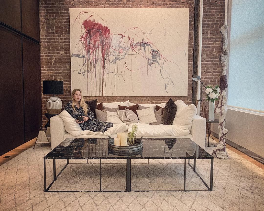 Image may contain: Caspar Jopling, Ellie Goulding, wedding, ceremony, pictures, wife, husband, fiancé, age, Instagram, together, family, job, Soho, New York, apartment, Rug, Coffee Table, Person, Human, Table, Indoors, Living Room, Room, Furniture, Couch