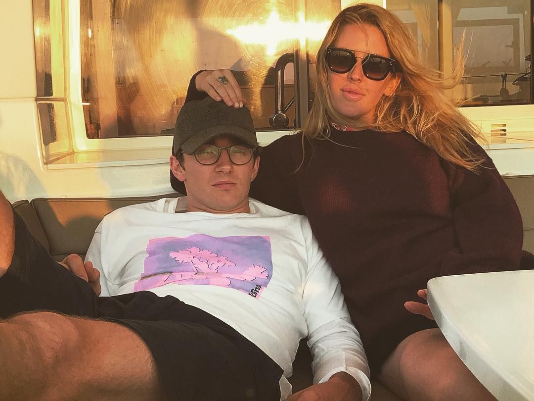 Image may contain: Caspar Jopling, Ellie Goulding, wedding, ceremony, pictures, wife, husband, fiancé, age, Instagram, together, family, job, Sitting, Cushion, Teen, Female, Woman, Child, Kid, Blonde, Girl, Clothing, Apparel, Accessory, Sunglasses, Accessories, Person, Human