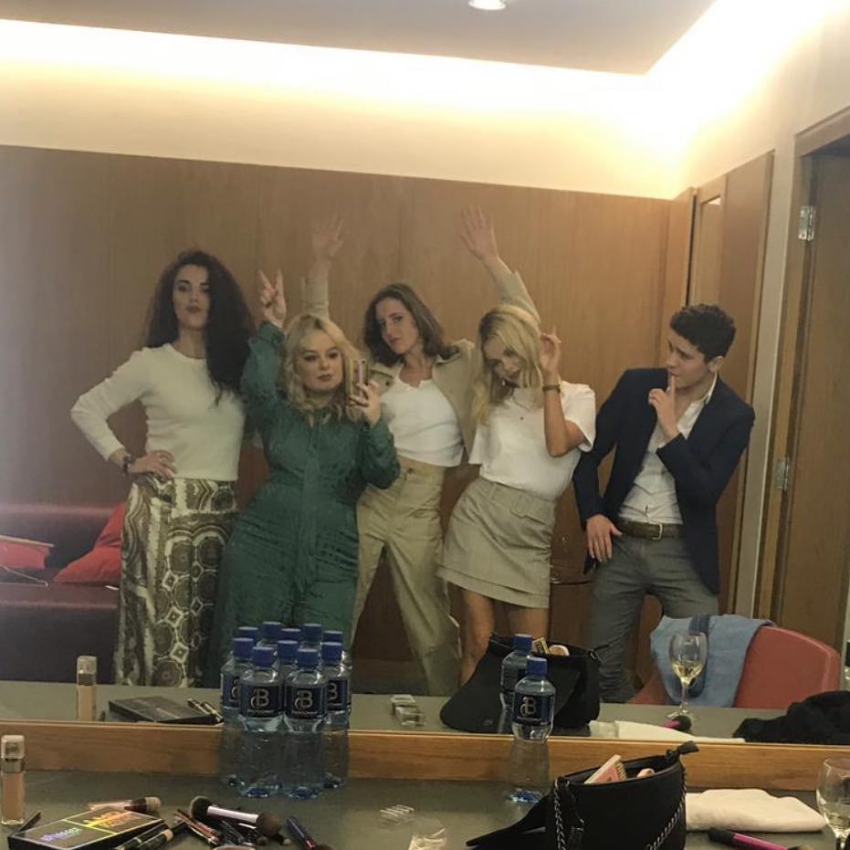 Image may contain: Derry Girls cast, Derry Girls, Dylan Llewellyn, James, age, how old, Instagram, from, Netflix, Channel 4, season 2, season 3, Wood, Plywood, Coat, Overcoat, Suit, Table, Sitting, Apparel, Clothing, Room, Indoors, Furniture, Person, Human