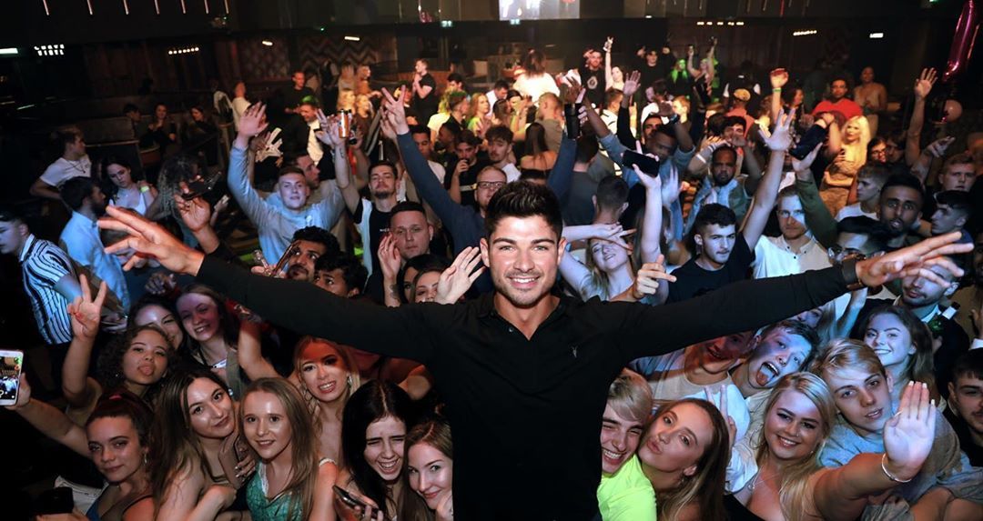 Image may contain: Love Island 2019 contestants, Love Island, 2019, now, job, Instagram, updates, news, latest, series five, Anton Danyluk, Accessories, Accessory, Sunglasses, Disco, Face, Audience, Crowd, Club, Night Club, Person, Human, Party, Night Life