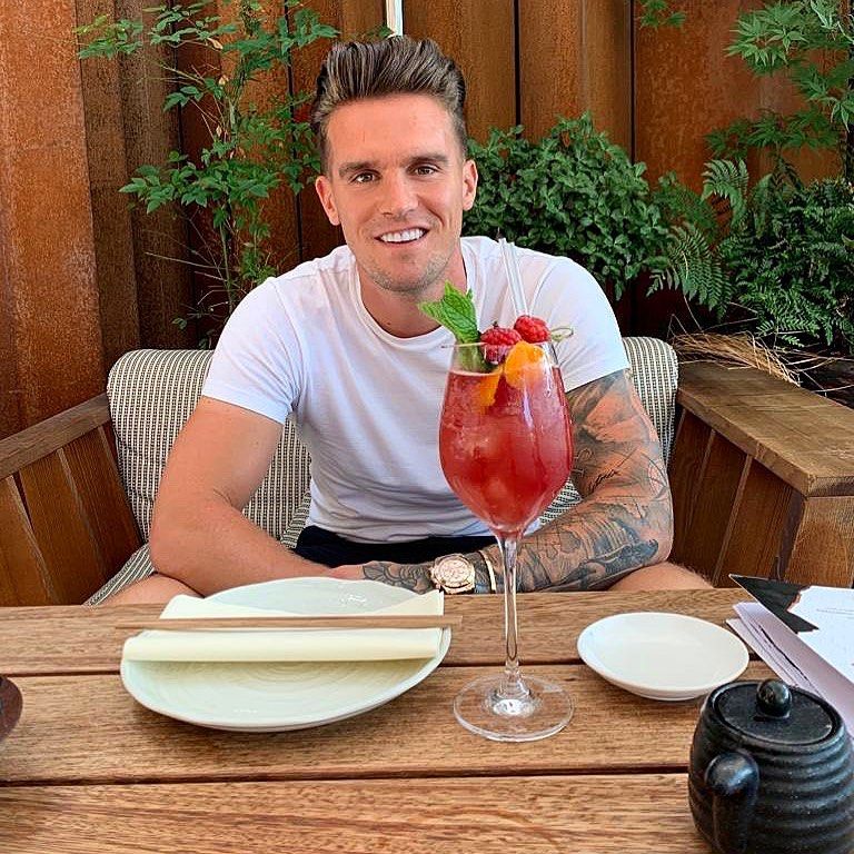 Image may contain: reality TV rich list, UK, reality TV, net worth, earnings, money, salary, rich, worth, Gaz Beadle, Geordie Shore, Hardwood, Plywood, Drink, Cocktail, Alcohol, Beverage, Person, Human, Wood