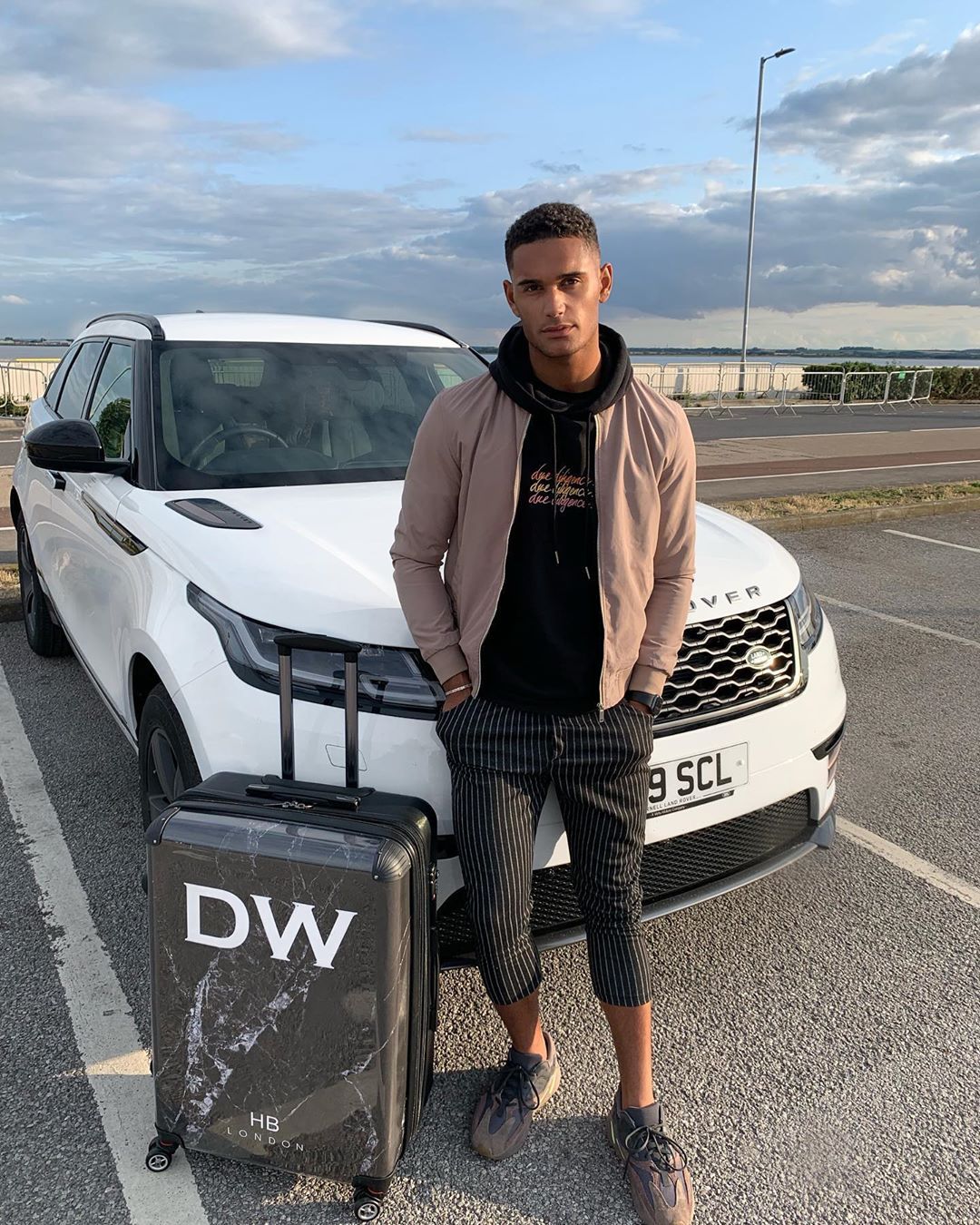 Image may contain: Love Island 2019 contestants, Love Island, 2019, now, job, Instagram, updates, news, latest, series five, Danny Williams, Sleeve, Car Wheel, Wheel, Machine, Pedestrian, Car, Automobile, Transportation, Vehicle, Tire, Road, Clothing, Apparel, Person, Human