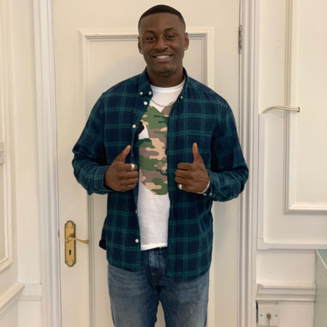 Image may contain: Love Island 2019 contestants, Love Island, 2019, now, job, Instagram, updates, news, latest, series five, Sherif Lanre, Wood, Man, Home Decor, Door, Pants, Human, Person, Apparel, Clothing