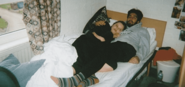 Two students in bed