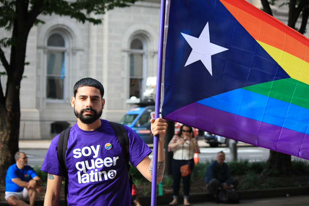 Sergio Moralez-Garcia and other members of the Philadelphia organization Galai waved flags throughout the night to represent the Latinx LGBT community.