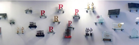 Our awards wall in the office