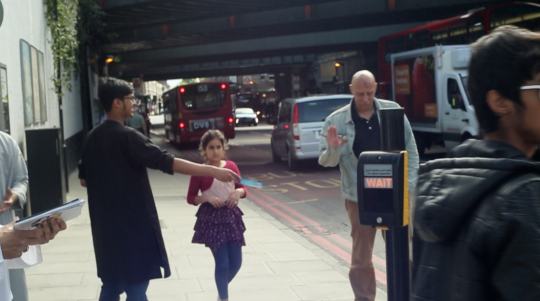 A passer-by refuses a leaflet from the Islamic Roadshow